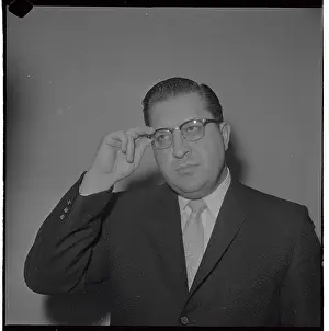 William E. Bufalino Adjusting His Eyeglasses