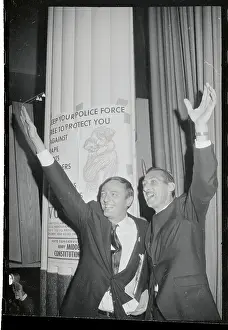 William F. Buckley Jr. and Paul L. Adams Waving From Podium
