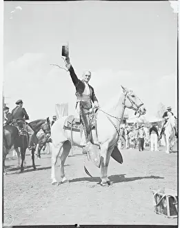 Pomona Prints: William G. McAdoo on a Horse and Holding up His Hat