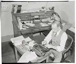 William Sexton Typing out Editorial at Typewriter