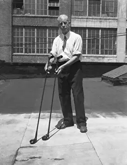 Willie Dunn with Two-Headed Golf Clubs