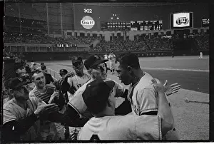 Willie Mays Being Congratulated by Teammates