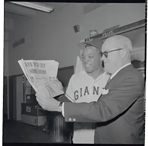 Willie Mays and Horace Stoneham Reading Newspaper