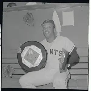 Willie Mays Sitting and Holding His Award
