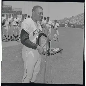 Willie Mays Standing at Microphone with Award