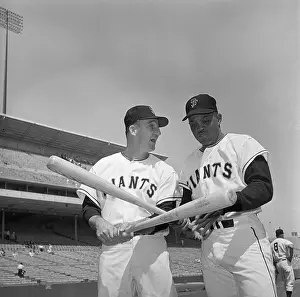 Willie Mays and Warren Spahn Holding Baseball Bats