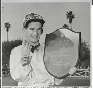 Willie Shoemaker Holding Plaque