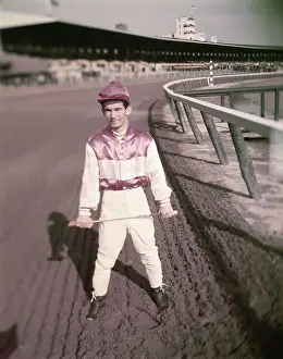 Willie Shoemaker Holding Racing Crop
