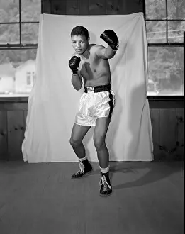 Prints of GREENWOOD LAKE, NY - JUNE 12: Middleweight professional boxer Willie Vaughn of the United States poses for a portrait on June 12, 1956 in Greenwood Lake, New York In the Ring: The Art of Boxing: Willie Vaughn