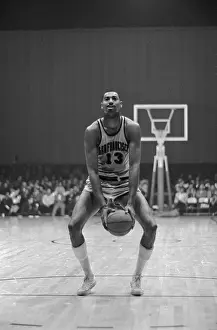 Wilt Chamberlain with Basketball Between Knees