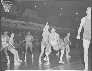 Wilt Chamberlain in a Foul Mood During Basketball Action