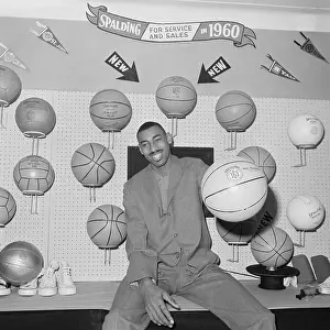 Wilt Chamberlain Holding a Basketball