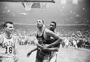 Wilt Chamberlain Holding Back Bill Russell