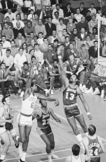 Wilt Chamberlain Jumping to Block Shot