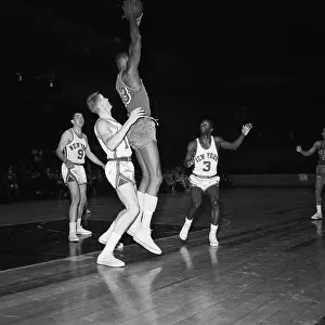 Wilt Chamberlain Jumping Holding Ball