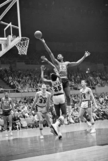 Wilt Chamberlain Jumping Over LeRoy Ellis