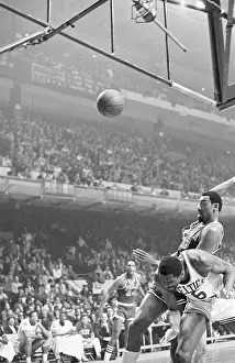 Wilt Chamberlain Landing on Bill Russell's Back