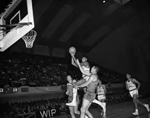 Wilt Chamberlain Leaping to Shoot Basket