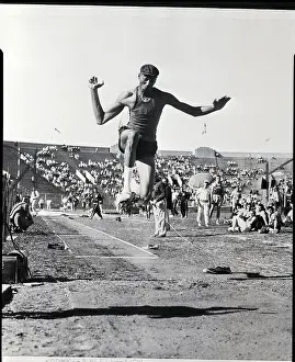 Long Jump Prints: Wilt Chamberlain in Mid Air Doing Long Jump