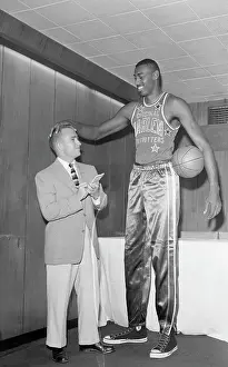 Basketball Team Prints: Wilt Chamberlain Talking with Short Reporter