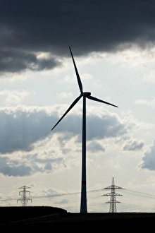 Images Dated 17th August 2014: Wind turbine, utility poles and power lines, silhouettes, Oening, Bavaria, Germany