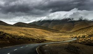 winding road passing through tibet landscape