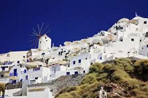 Windmill and white houses in Santorini, Greece