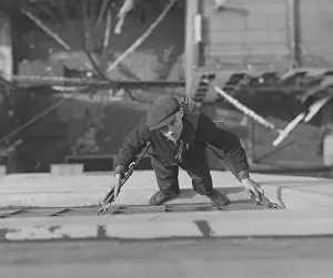 Prints of A man pictured cleaning windows supported by a harness, USA, circa 1930 Daredevil Construction Worker Prints: Window Cleaner