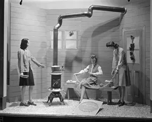 Prints of Window Display at Marshall Field and Company, Snug and Snazzy High School Shop scene with mannequins stringing popcorn for Christmas decorations, Chicago, Illinois, 1945 Celebrate the Season: A Curated Collection of Christmas Art: Window Display At Marshall Field & Company