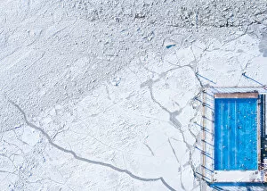 Images Dated 24th February 2018: Wintery top-down aerial view of a heated swimming pool next to frozen Baltic sea