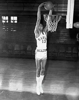 Prints of (Original Caption). Wilt Chamberlain is shown going up for the basket. Undated photograph Hoops Through Time: A Visual Journey of Basketball History: Witl Chamberlain Going Up For Basket