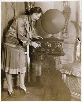 Dial Prints: Woman Adjusting Dial On Early Radio