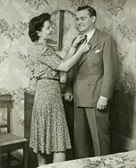 Dressing Table Prints: Woman adjusting mans tie at dressing table