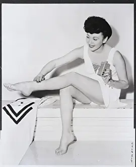 Woman Applying Stocking Makeup On Leg