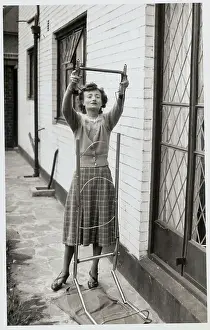 Woman Assembling a Ladder