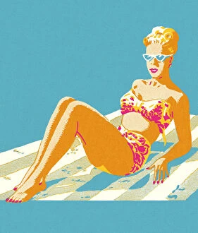 Images Dated 14th May 2014: Woman in a Bikini Sitting on a Blanket