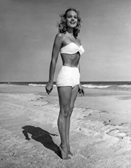 Woman in bikini standing on beach