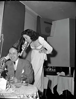 Horn Prints: Woman Blowing Horn into Man's Ear