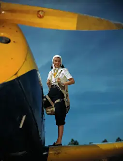 Woman Boarding Plane with Parachute
