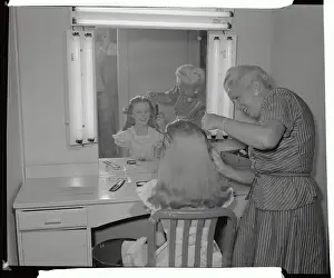 Clean Prints: Woman Brushing Kathryn Beaumont's Hair Before Vanity Mirror