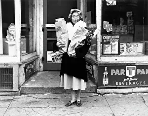 Groceries Prints: Woman Carrying Groceries In Front/Store