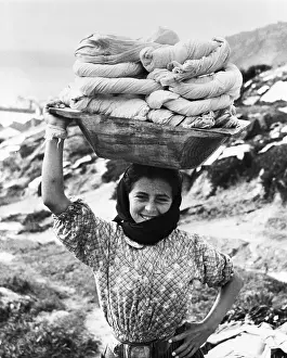Balancing Prints: Woman Carrying Laundry On Her Head