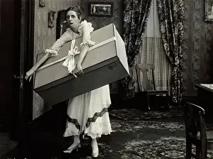 Overwhelming Prints: Woman Carrying Wrapped Present