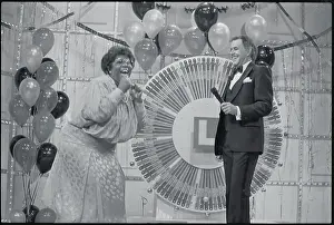 Woman Celebrating at Lottery Wheel
