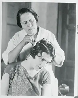 Woman Chalking Leatrice Joy's Hair