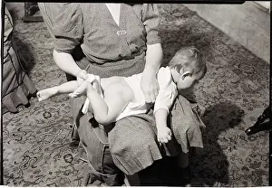 Woman Changing Baby on Lap