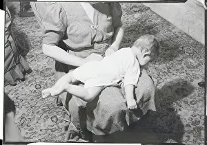 Lying Down Prints: Woman Changing Baby's Diaper