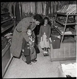 Woman with Children Shopping in Store
