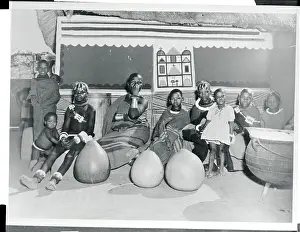 Pretoria Prints: Woman and Children Sitting in Front of a Hut