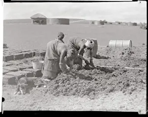 Woman and Children Working in Soil